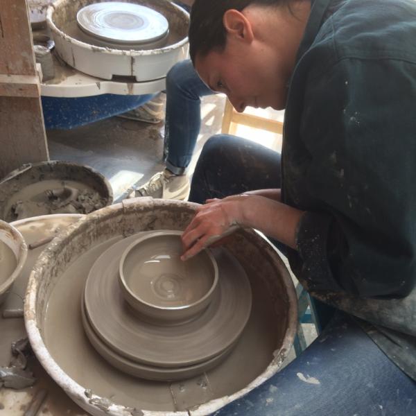 Throwing a bowl on the pottery wheel