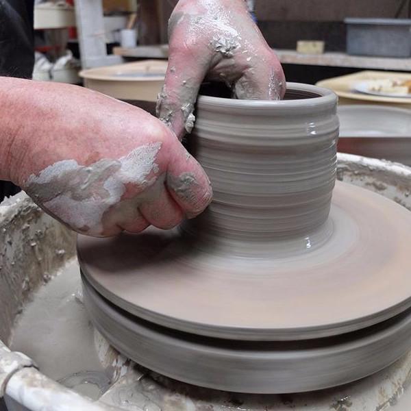 Pulling up a cylinder on the pottery wheel